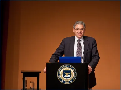 Dr. Keoleian standing at a podium