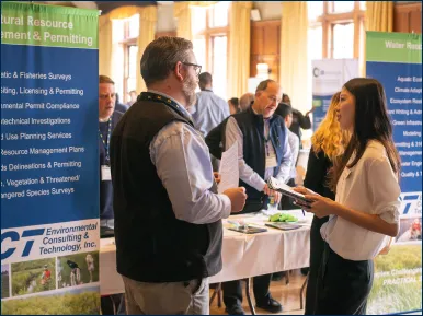 students discussing topics at a job fair