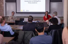 People in a conference room listening to speakers